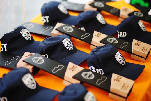 CGRC caps and 1st, 2nd and 3rd place awards laid out for the podium